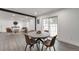 Cozy dining area with modern table, stylish chairs, and easy access to the living room at 1326 Sable Blvd, Aurora, CO 80011