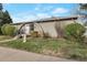 Charming single-story home with a grassy front yard and unique architecture with an arched entry at 1326 Sable Blvd, Aurora, CO 80011