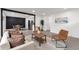 Open-concept layout with stylish living room, adjacent dining area, and modern finishes at 1326 Sable Blvd, Aurora, CO 80011