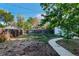 Spacious backyard showcasing mature trees and a well-maintained lawn, perfect for outdoor activities and relaxation at 2658 W 1St Ave, Denver, CO 80219