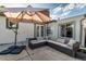 Outdoor patio area featuring comfortable seating under a large umbrella, perfect for entertaining and relaxation at 2658 W 1St Ave, Denver, CO 80219