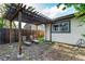 Charming pergola in the backyard with seating, creating a peaceful retreat for outdoor enjoyment at 2658 W 1St Ave, Denver, CO 80219