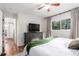 Bedroom boasting modern ceiling fan, closet, and dresser with mounted television at 2658 W 1St Ave, Denver, CO 80219