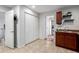 A kitchen area with tiled flooring that leads to a laundry area at 2658 W 1St Ave, Denver, CO 80219