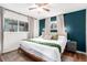Stylish main bedroom with hardwood floors, a neutral color palette, and great natural light at 2658 W 1St Ave, Denver, CO 80219