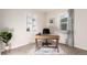 Home office features a desk, chair, built-in shelves, and a large window at 2658 W 1St Ave, Denver, CO 80219