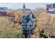 Aerial perspective of historic house with turret, surrounded by trees, near downtown at 1459 N Pennsylvania St # B, Denver, CO 80203