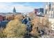 Aerial view of a Victorian home in an urban setting with mature trees at 1459 N Pennsylvania St # B, Denver, CO 80203