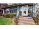 Inviting entrance featuring stone steps, classic porch columns, and a modern glass front door with sidelights at 1459 N Pennsylvania St # B, Denver, CO 80203