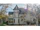 Exterior shot of a stately Victorian-era home with intricate architectural details at 1459 N Pennsylvania St # B, Denver, CO 80203