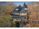 Victorian home featuring a turret, balcony, and inviting front porch illuminated at twilight at 1459 N Pennsylvania St # B, Denver, CO 80203