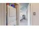 Laundry nook with stacked appliances is located in a hallway space at 1459 N Pennsylvania St # B, Denver, CO 80203