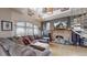 Living room featuring a sectional sofa, stone fireplace, and arched windows at 1459 N Pennsylvania St # B, Denver, CO 80203