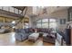 Living room with spiral staircase and cozy gray sofa at 1459 N Pennsylvania St # B, Denver, CO 80203