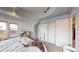 Main bedroom featuring a curved ceiling, multiple windows, and ample closet space at 1459 N Pennsylvania St # B, Denver, CO 80203