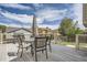 Back deck, perfect for outdoor dining and entertaining, features a full patio set at 9882 Harris St, Thornton, CO 80229