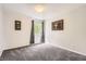 Light-filled bedroom with soft carpeting, a window, and neutral walls at 9882 Harris St, Thornton, CO 80229