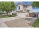 Beautiful home exterior with a long driveway and lush green lawn at 9882 Harris St, Thornton, CO 80229