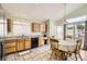 Eat in kitchen featuring bright natural light, tile floors and plenty of room for the Gathering at 9882 Harris St, Thornton, CO 80229