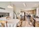 Kitchen dining area offering tile floors, stainless steel appliances and bright natural light at 9882 Harris St, Thornton, CO 80229