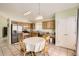 Spacious kitchen dining with stainless steel appliances, tile flooring, and eat in kitchen at 9882 Harris St, Thornton, CO 80229
