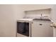 Convenient laundry room with modern washer and dryer at 9882 Harris St, Thornton, CO 80229