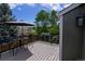 Deck with a table and chairs set, ideal for outdoor dining or relaxation with a view of the lush backyard at 12498 W Prentice Dr, Littleton, CO 80127
