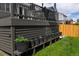 Deck showcasing potted plants along the railing, enhancing the outdoor living space with greenery at 12498 W Prentice Dr, Littleton, CO 80127