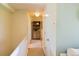 Bright hallway with neutral walls, providing a clean and seamless transition between rooms at 12498 W Prentice Dr, Littleton, CO 80127