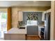 Modern kitchen with stainless steel appliances, white cabinets, and stylish countertops at 12498 W Prentice Dr, Littleton, CO 80127