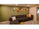 Spacious living room showcases an accent wall, stylish decor, and comfortable seating at 12498 W Prentice Dr, Littleton, CO 80127
