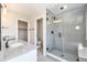 Elegant bathroom featuring a double vanity and frameless glass shower with modern fixtures at 2078 S Holly St # 1, Denver, CO 80222