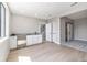Finished bonus room features a bar area and access to a bedroom and stairs at 2078 S Holly St # 1, Denver, CO 80222