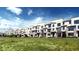 Modern townhomes with contemporary design and landscaping, offering stylish living at 2078 S Holly St # 1, Denver, CO 80222