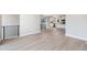 Bright living space with sleek flooring and modern black railings at 2078 S Holly St # 1, Denver, CO 80222