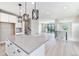Open concept living space including a kitchen, living room, and stairs at 2078 S Holly St # 1, Denver, CO 80222