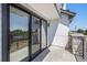 Private patio with sleek black railings, offering a space for outdoor relaxation at 2078 S Holly St # 1, Denver, CO 80222
