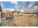 Spacious backyard featuring an outdoor dining set, a hammock, and a wood fence at 7930 Quitman St, Westminster, CO 80030
