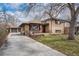 Charming single-Gathering home with brick exterior, welcoming front porch, and long driveway to a detached garage at 7930 Quitman St, Westminster, CO 80030