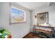 Charming interior featuring a stained glass window, decorative bar, and plants at 7930 Quitman St, Westminster, CO 80030