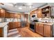 Well-equipped kitchen featuring stainless steel appliances, ample cabinet space, and hardwood flooring at 7930 Quitman St, Westminster, CO 80030