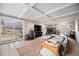Cozy living room with a fireplace, sliding glass doors to the patio, and comfortable seating at 7930 Quitman St, Westminster, CO 80030