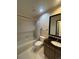 Clean bathroom with a shower/tub combo and granite countertop at 9866 Carmel Ct, Lone Tree, CO 80124