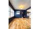 Bright dining area with hardwood floors, large windows, and stylish wall art at 9866 Carmel Ct, Lone Tree, CO 80124