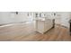 Bright eat-in kitchen featuring a large island with sleek countertops and stainless appliances at 6615 N Nepal St, Aurora, CO 80019