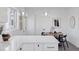 Kitchen dining area with round wooden table and black chairs at 1130 Oak Pl, Thornton, CO 80229