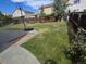 Fenced backyard with a concrete patio and basketball hoop at 19877 E 40Th Ave, Denver, CO 80249