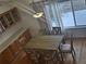 Bright dining area with hardwood floors and large window at 19877 E 40Th Ave, Denver, CO 80249