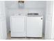 Laundry room with Samsung washer and dryer, and shelving at 19877 E 40Th Ave, Denver, CO 80249