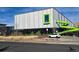 Modern pool house with a green slide and large windows at 19877 E 40Th Ave, Denver, CO 80249